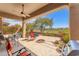 Open-air patio with poolside seating and golf course view at 9327 E Whitewing Dr, Scottsdale, AZ 85262