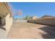 Spacious backyard features a covered patio, block wall, and potential for landscaping at 9541 W Frank Ave, Peoria, AZ 85382