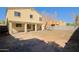 This backyard is complete with a covered patio and plenty of space for entertaining at 9541 W Frank Ave, Peoria, AZ 85382