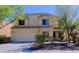 Two-story home with a neutral color palette, well-maintained landscaping, and attached two-car garage at 9541 W Frank Ave, Peoria, AZ 85382