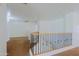 Upstairs hallway featuring carpet, a white wall and wood and metal railing at 9541 W Frank Ave, Peoria, AZ 85382