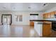 Spacious open-concept kitchen and dining area with natural lighting and tile floors at 9541 W Frank Ave, Peoria, AZ 85382