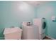 Well-equipped laundry room with modern appliances and a convenient utility sink at 9541 W Frank Ave, Peoria, AZ 85382