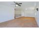 Upstairs living room featuring carpet, a white wall and wood and metal railing at 9541 W Frank Ave, Peoria, AZ 85382