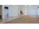 View of open-concept living space with stairs, bathroom, and tile and carpet flooring at 9541 W Frank Ave, Peoria, AZ 85382