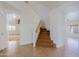 Bright entryway featuring a carpeted staircase and tile flooring at 9541 W Frank Ave, Peoria, AZ 85382