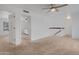 This carpeted bedroom features white walls and a view to the other rooms at 17808 N 45Th Ave, Glendale, AZ 85308