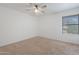 Bedroom with window with blinds, neutral carpet, and white walls at 17808 N 45Th Ave, Glendale, AZ 85308