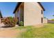 The side of the two-story home shows a grassy yard and bushes near the building at 17808 N 45Th Ave, Glendale, AZ 85308