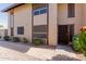 Charming two-story home featuring a front door with security screen and well-maintained landscaping at 17808 N 45Th Ave, Glendale, AZ 85308