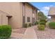 Exterior view of property with well-maintained landscaping along the walkway, providing a welcoming atmosphere at 17808 N 45Th Ave, Glendale, AZ 85308