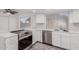 Updated kitchen features stainless steel appliances, white cabinets, and granite countertops at 17808 N 45Th Ave, Glendale, AZ 85308