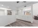 Contemporary kitchen featuring white cabinets, a marble backsplash, and an open layout at 17808 N 45Th Ave, Glendale, AZ 85308