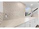 Renovated kitchen showcases sleek cabinets and stylish tile backsplash with marble counters at 17808 N 45Th Ave, Glendale, AZ 85308