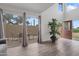 Bright living room with wood floors, slider to patio, and large window to outdoor patio at 17808 N 45Th Ave, Glendale, AZ 85308