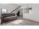 Bright living room with a staircase, vaulted ceilings, and laminate flooring at 17808 N 45Th Ave, Glendale, AZ 85308