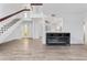 Open-concept living space with staircase and electric fireplace at 17808 N 45Th Ave, Glendale, AZ 85308