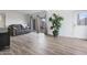 Bright living room with wood floors, slider to patio, and comfortable sofa at 17808 N 45Th Ave, Glendale, AZ 85308