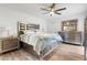 Bedroom with light-colored walls, ceiling fan and wood-look floors at 17808 N 45Th Ave, Glendale, AZ 85308