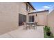 Cozy patio area with table, chairs, and sliding door access to interior spaces at 17808 N 45Th Ave, Glendale, AZ 85308