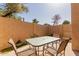 Cozy patio area featuring a glass-top table and comfortable seating, perfect for outdoor relaxation at 17808 N 45Th Ave, Glendale, AZ 85308