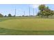 Well-manicured putting green with flags on a golf course at 17808 N 45Th Ave, Glendale, AZ 85308