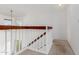 Bright staircase landing with white railings and natural light, providing an airy feel at 17808 N 45Th Ave, Glendale, AZ 85308