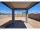 View of a backyard featuring a covered patio and block wall at 18220 W Daley Ln, Surprise, AZ 85387