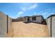 View of the backyard featuring a covered patio at 18220 W Daley Ln, Surprise, AZ 85387