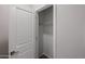 A well-lit closet with a hanging rod and plenty of storage space at 18220 W Daley Ln, Surprise, AZ 85387
