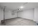 Spacious two-car garage with an automatic door opener and ample room for storage at 18220 W Daley Ln, Surprise, AZ 85387