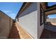 Exterior view showcases textured walls, complemented by a covered patio area at 18220 W Daley Ln, Surprise, AZ 85387