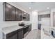 Well-equipped kitchen with granite countertops, stainless appliances, and stylish cabinetry at 18220 W Daley Ln, Surprise, AZ 85387