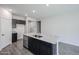 Kitchen featuring granite island, stainless steel appliances, and modern cabinetry at 18220 W Daley Ln, Surprise, AZ 85387