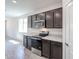 Modern kitchen featuring stainless steel appliances, and sleek countertops at 18220 W Daley Ln, Surprise, AZ 85387