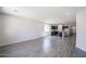 Open-concept living space leads into a modern kitchen, perfect for entertaining at 18220 W Daley Ln, Surprise, AZ 85387