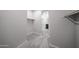 Hallway with walk-in closet, plenty of storage space, shelving, and carpet at 18220 W Daley Ln, Surprise, AZ 85387