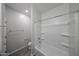 Bright bathroom features a shower/tub combo with a white tub, and wood-look floors at 18244 W Daley Ln, Surprise, AZ 85387