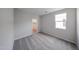 Bedroom features neutral walls, carpet flooring, and an adjacent walk-in closet at 18244 W Daley Ln, Surprise, AZ 85387