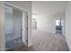 Spacious bedroom with plush carpeting and ample natural light streaming in from the windows at 18244 W Daley Ln, Surprise, AZ 85387