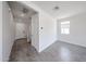 Inviting entryway with neutral tones and wood-look tile flooring for a modern aesthetic at 18244 W Daley Ln, Surprise, AZ 85387