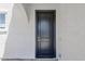 Elegant black front door with vertical panels and a modern digital lock system at 18244 W Daley Ln, Surprise, AZ 85387