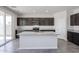 Modern kitchen island with granite countertop, stainless appliances, and plenty of storage at 18244 W Daley Ln, Surprise, AZ 85387