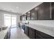 Spacious kitchen featuring granite countertops, ample cabinetry, and stainless steel appliances at 18244 W Daley Ln, Surprise, AZ 85387