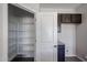 Walk-in pantry with shelving and a countertop area for storage and organization at 18244 W Daley Ln, Surprise, AZ 85387