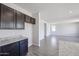 Additional corner of the kitchen area with extra cabinets and countertop, adjacent to walk-in pantry at 18244 W Daley Ln, Surprise, AZ 85387
