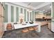 A bright dining room with modern lighting, decorative furnishings, and a striped accent wall at 333 N Pennington Dr # 55, Chandler, AZ 85224