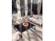 Outdoor patio featuring a modern black table and comfortable seating area with white cushions at 333 N Pennington Dr # 55, Chandler, AZ 85224