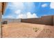 Expansive backyard featuring dirt landscaping and a perimeter block fence at 10347 S Saguaro Dr, Apache Junction, AZ 85120