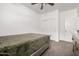 Bright bedroom featuring a ceiling fan, closet and carpet flooring at 10347 S Saguaro Dr, Apache Junction, AZ 85120